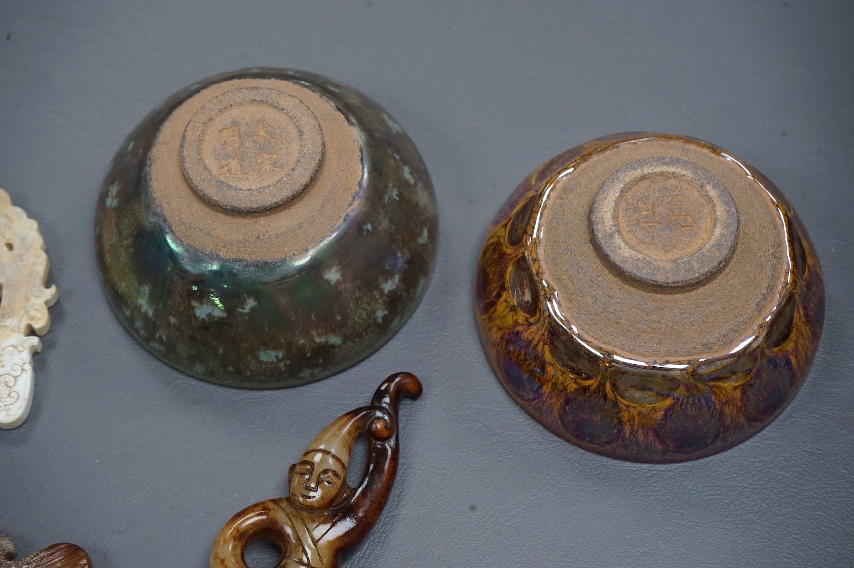Four Chinese carvings and two bowls.(6). Largest carving 14.5cm long.